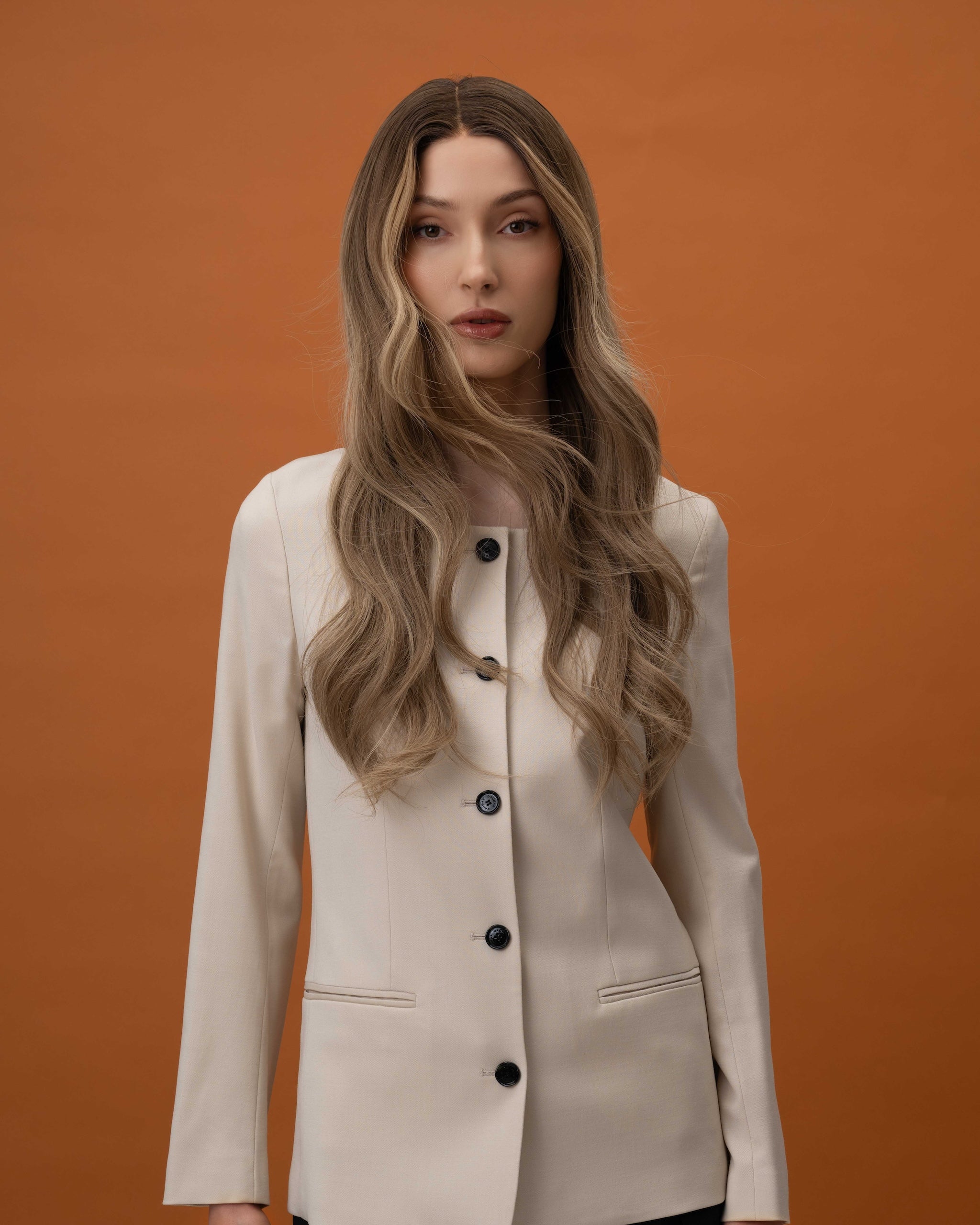 Noble Nightshade Wig 50 cm dark blonde root blending into lighter lengths with soft money-piece highlights, hand-tied 100% Remy human hair on HD lace, shown on model for a modern and luxurious look.