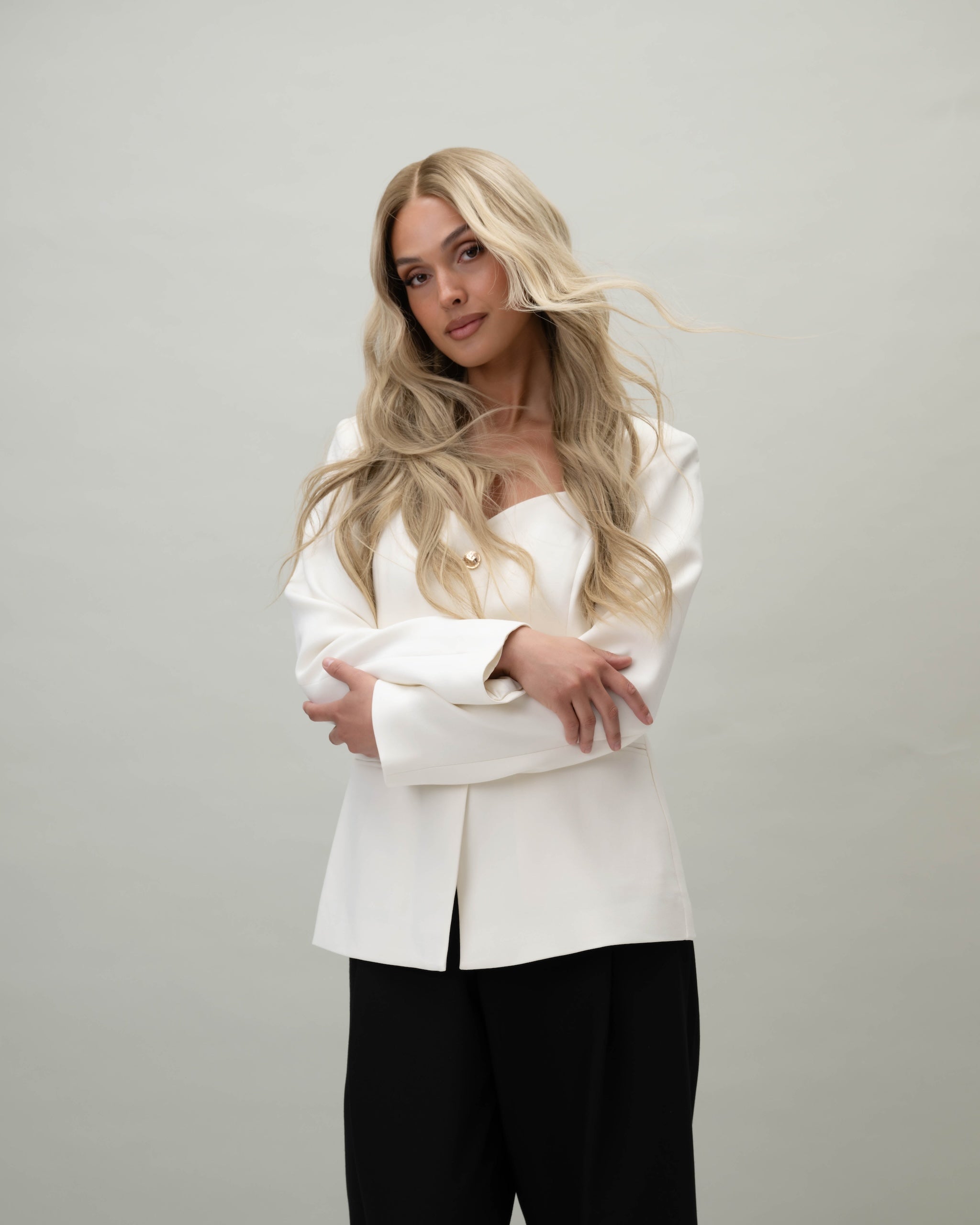 Scarlet Wig 50 cm natural blonde human hair wig with dark blonde root and soft lowlights for depth and realism, shown on model.