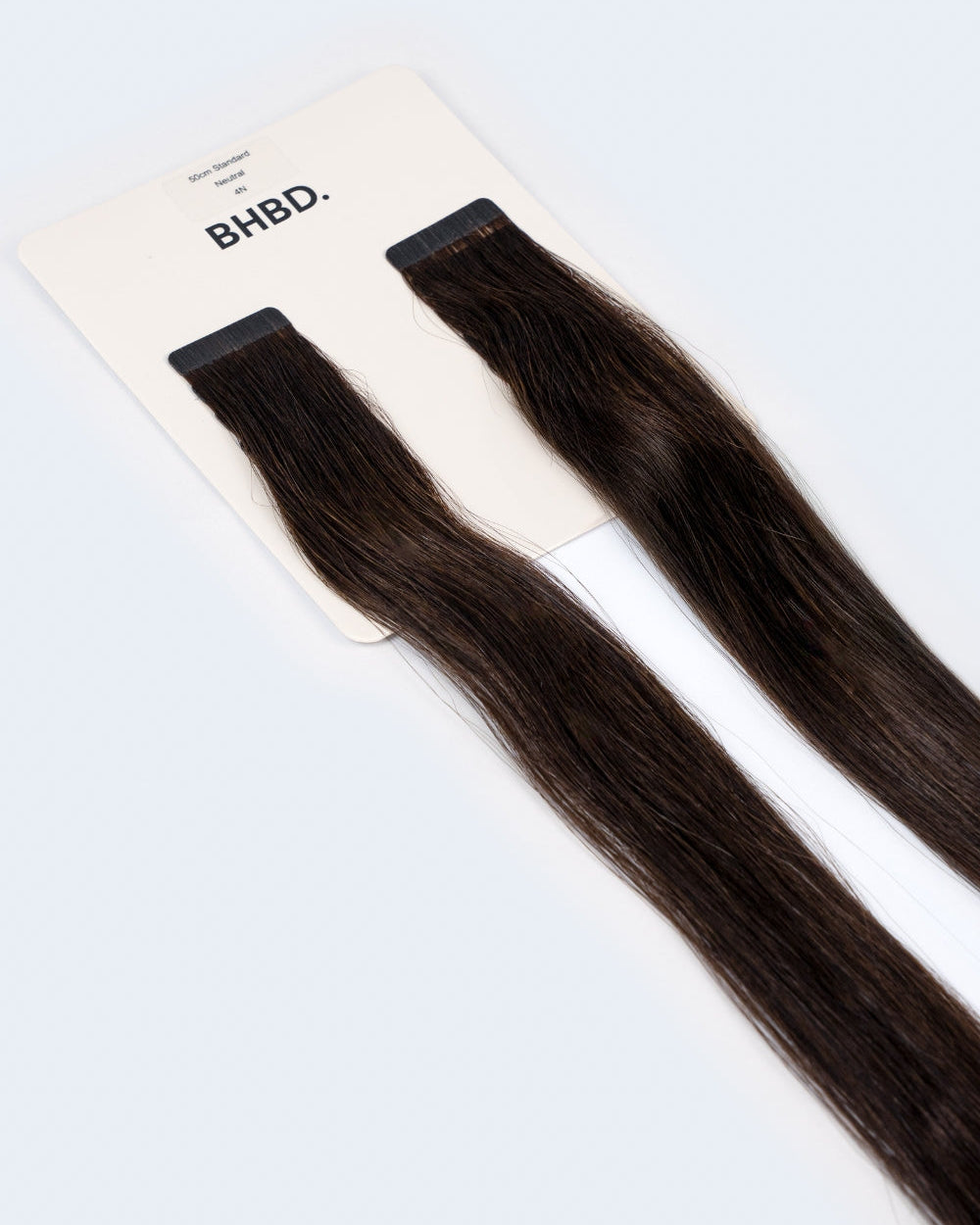 BHBD Tape Extensions 4N – pre-taped Remy human hair extensions in deep natural dark brown; seamless, soft and tangle-free; comes in 35cm, 50cm, and 60cm. 100% Remy hair, gentle extensions.