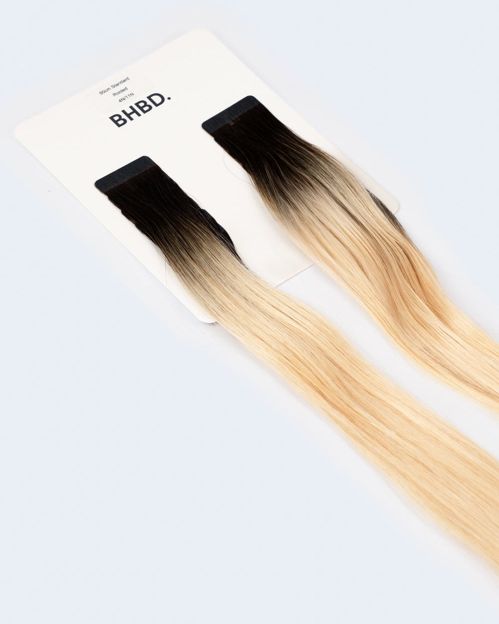BHBD Tape Extensions 4N/11N – pre-taped Remy human hair extensions in ombré dark brown to blonde; seamless, soft and tangle-free; comes in 35cm, 50cm, and 60cm. 100% Remy hair, gentle extensions.
