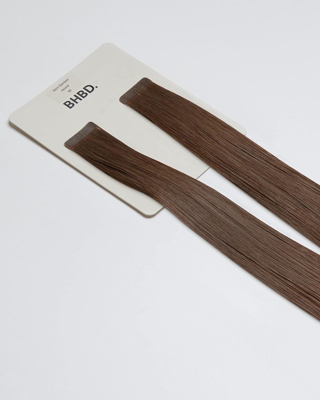 Tape Extensions 5B – pre-taped Remy human hair extensions in medium brown shade; seamless, soft and tangle-free; comes in 35cm, 50cm, and 60cm. 100% Remy hair, gentle extensions.