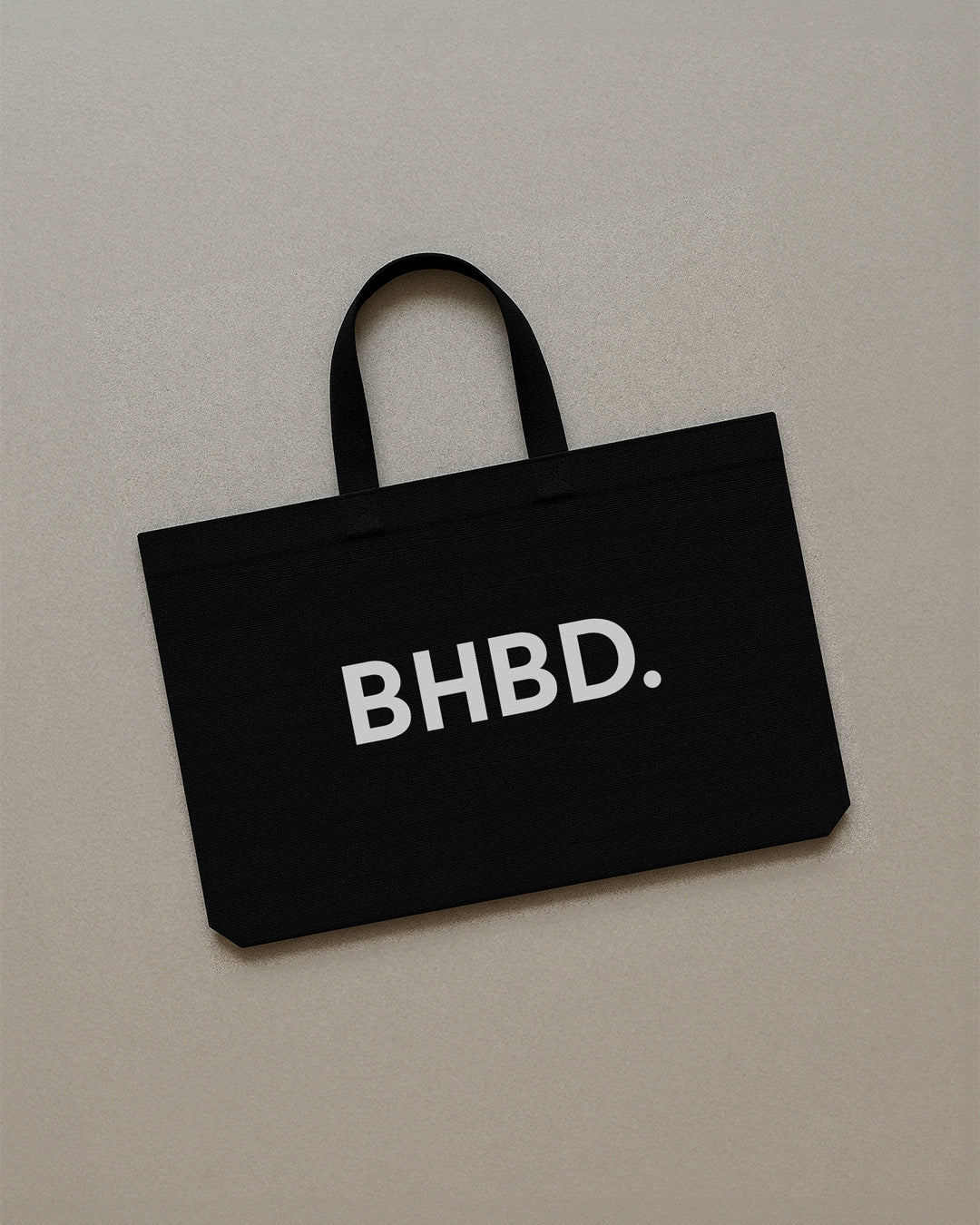 BHBD Tote Bag – black cotton tote bag with white BHBD logo, durable and lightweight for everyday essentials
