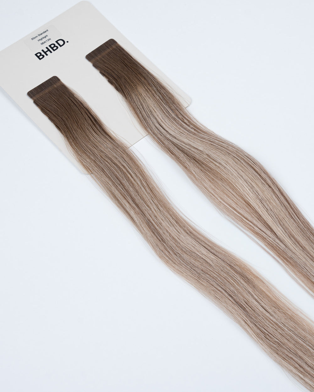 BHBD Tape Extensions 9BA/12N Highlight – pre-taped Remy human hair extensions in bright blonde with warm tones; seamless, soft and tangle-free; comes in 35cm, 50cm, and 60cm. 100% Remy hair, gentle extensions.