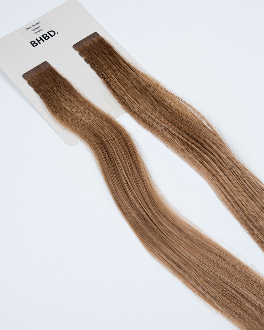 BHBD Tape Extensions 10NB/8N Highlight – pre-taped Remy human hair extensions in light brown and blonde highlights; seamless, soft and tangle-free; comes in 35cm, 50cm, and 60cm. 100% Remy hair, gentle extensions.