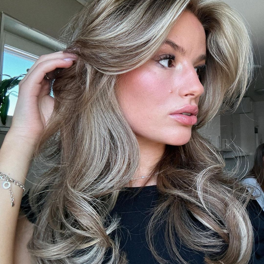 Woman with long brown hair created with BHBD hair extensions.