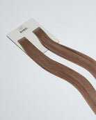 Tape Extensions 8PV/10BP – pre-taped Remy human hair extensions in pearl violet blonde and beige pearl tones; seamless, soft and tangle-free; comes in 35cm, 50cm, and 60cm. 100% Remy hair, gentle extensions.
