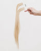 Tape Extensions 10NB/12N – pre-taped Remy human hair extensions in light beige blonde blended with natural blonde; seamless, soft and tangle-free; comes in 35cm, 50cm, and 60cm. 100% Remy hair, gentle extensions