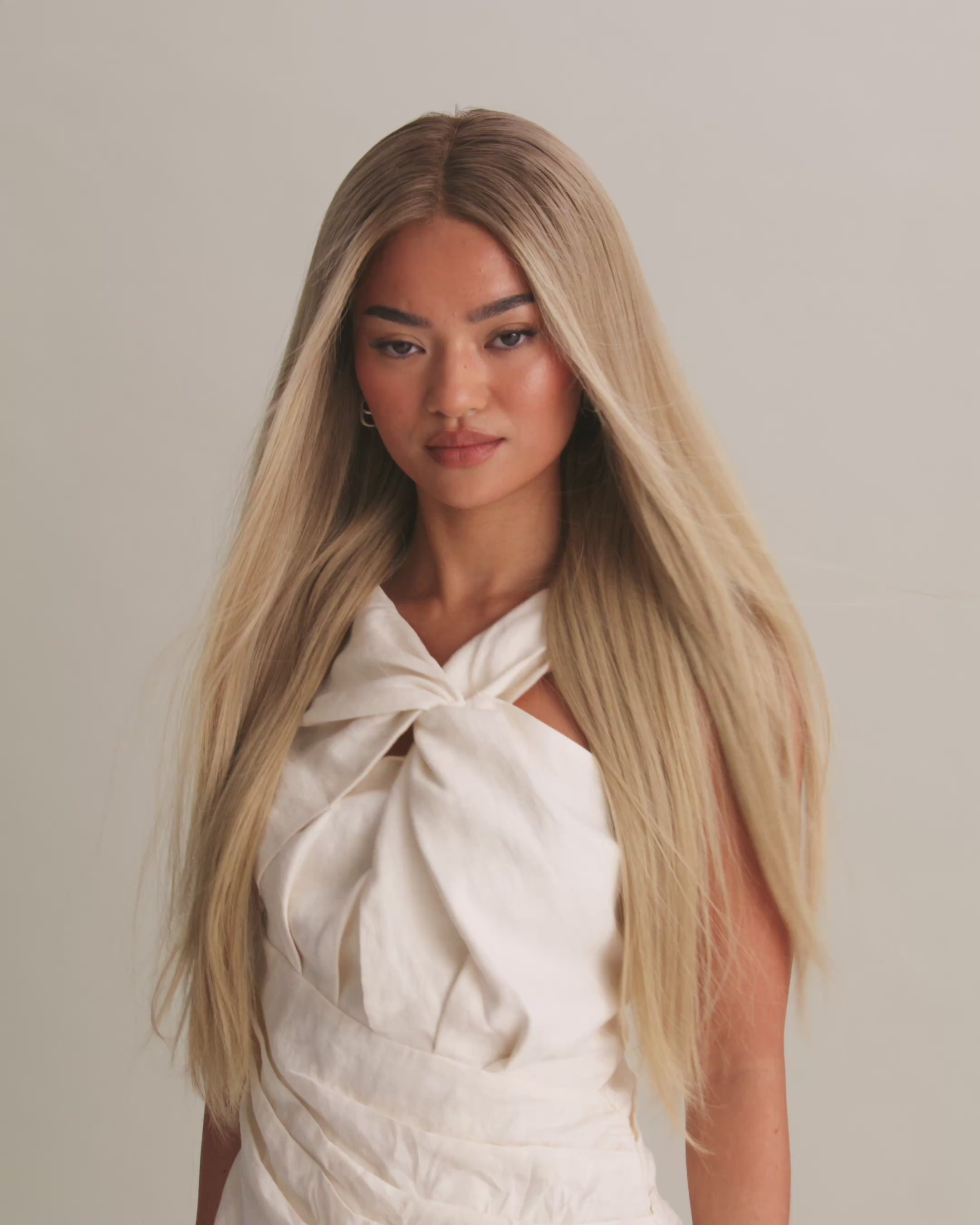 Video of Ash Blonde Wig 40 cm with ashy dark blonde root and blended blonde highlights, showing natural HD lace and hair movement.