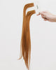 Tape Extensions 8CG – pre-taped Remy human hair extensions in copper golden blonde shade; seamless, soft and tangle-free; comes in 35cm, 50cm, and 60cm. 100% Remy hair, gentle extensions.