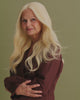 Detailed video showcasing the wig’s lifelike texture and how naturally the hair flows on the model wearing Livia Wig – 40cm light blonde lace wig with soft layered waves; hand-tied Remy hair and bleached knots for natural parting.