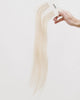 Tape Extensions 12N – pre-taped Remy human hair extensions in light natural blonde shade; seamless, soft and tangle-free; comes in 35cm, 50cm, and 60cm. 100% Remy hair, gentle extensions.
