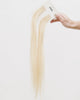 Tape Extensions 11N – pre-taped Remy human hair extensions in light natural blonde shade; seamless, soft and tangle-free; comes in 35cm, 50cm, and 60cm. 100% Remy hair, gentle extensions.