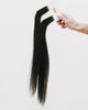 Tape Extensions 3N – pre-taped Remy human hair extensions in dark natural brown shade; seamless, soft and tangle-free; comes in 35cm, 50cm, and 60cm. 100% Remy hair, gentle extensions.
